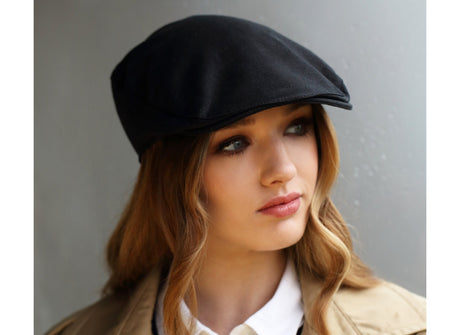 Woman wearing an Irish Linen Donegal Touring Cap by Hanna Hats