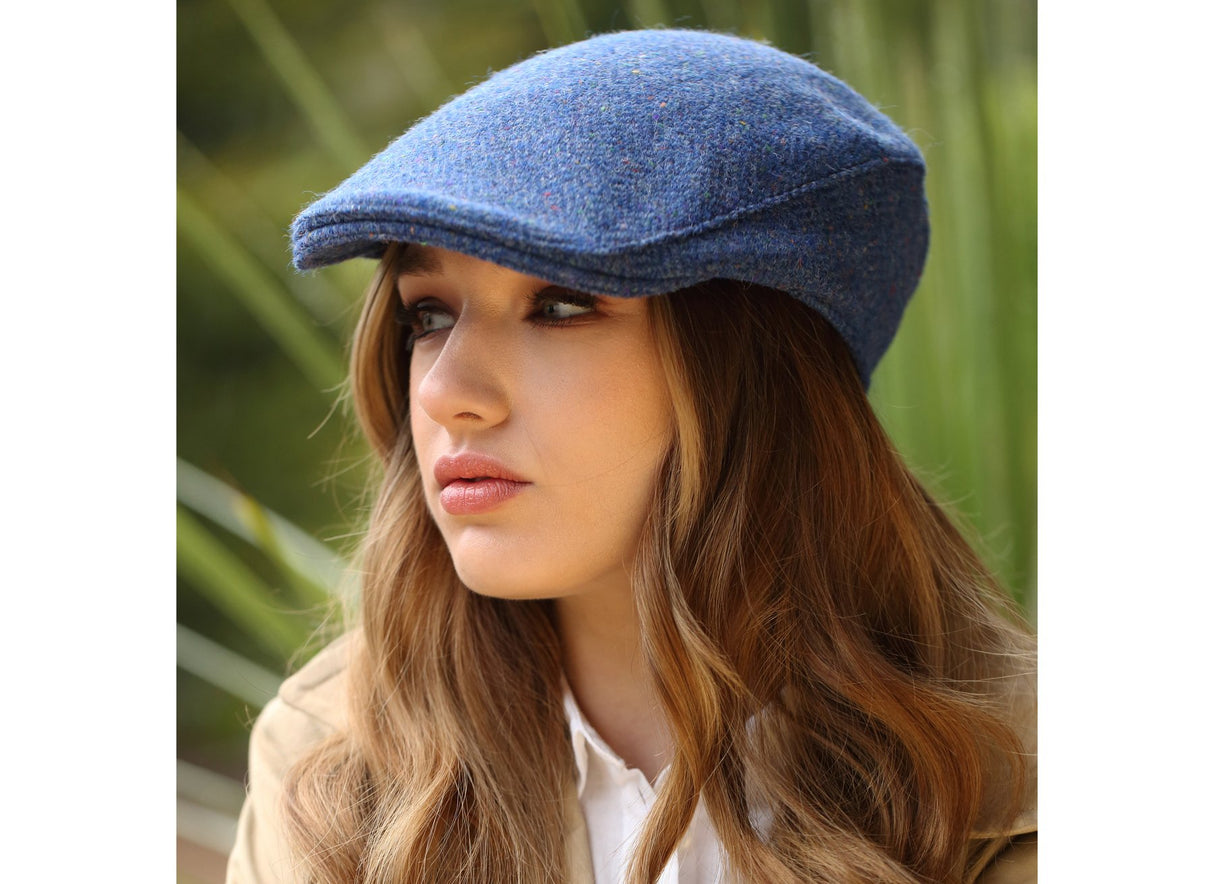 Woman wearing a Tweed Donegal Touring Cap by Hanna Hats