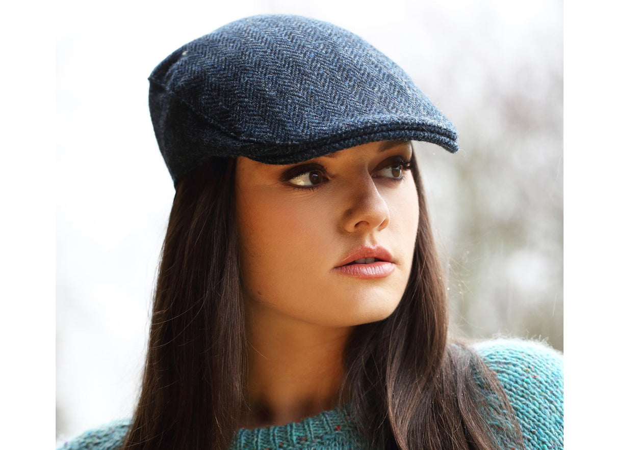 Woman wearing a Tweed Donegal Touring Cap by Hanna Hats