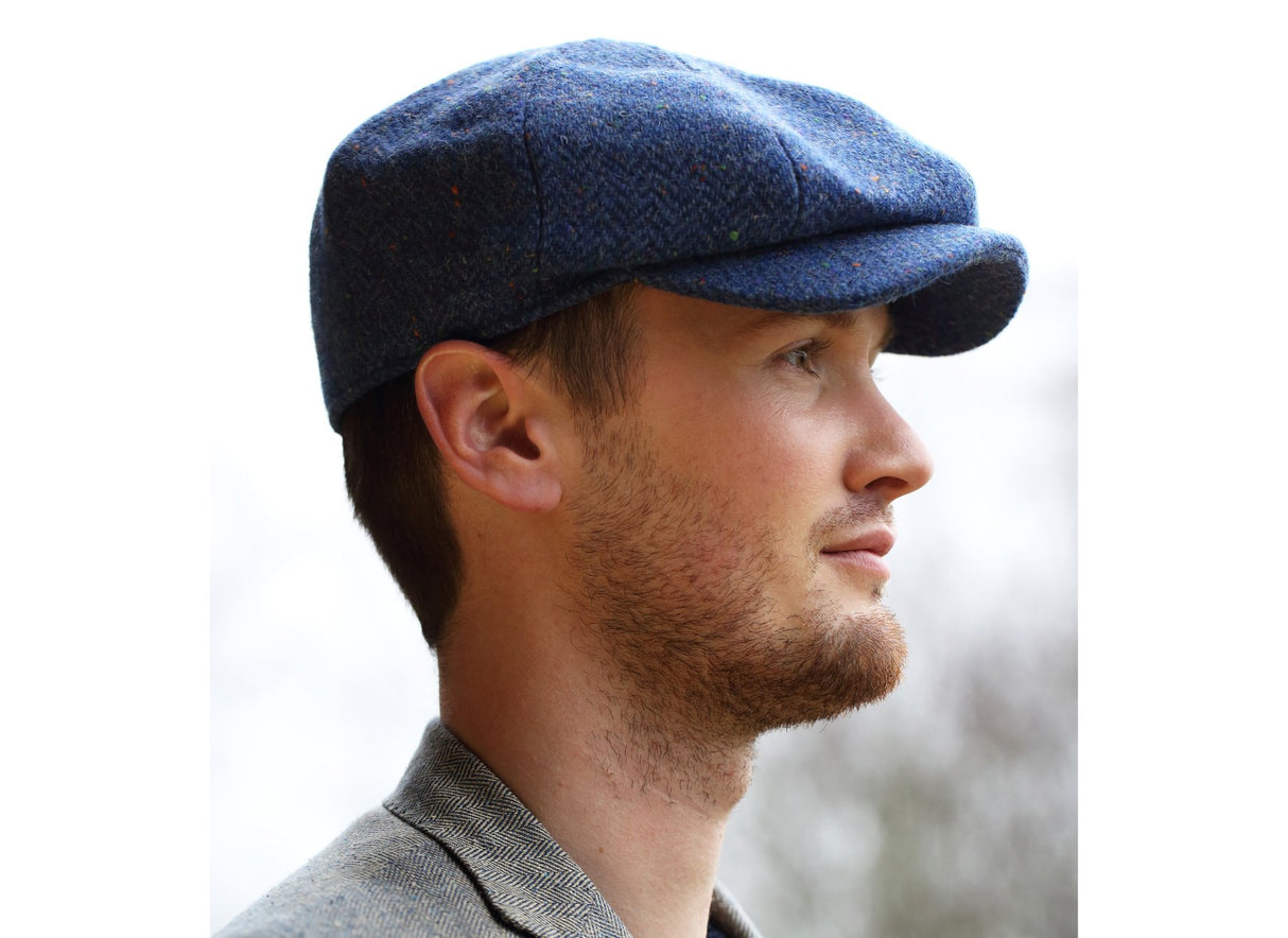 man wearing a High Azure Peaky Blinders style cap by Hanna Hats of Donegal