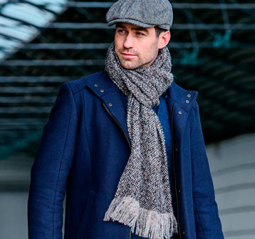 Man wearing Mucros weavers islander scarf and tweed cap