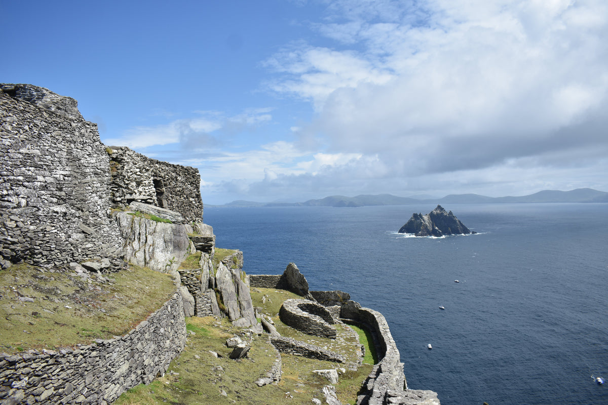 Stone monastery buildings on Skellig Michael overlooking Little Skellig and the sea