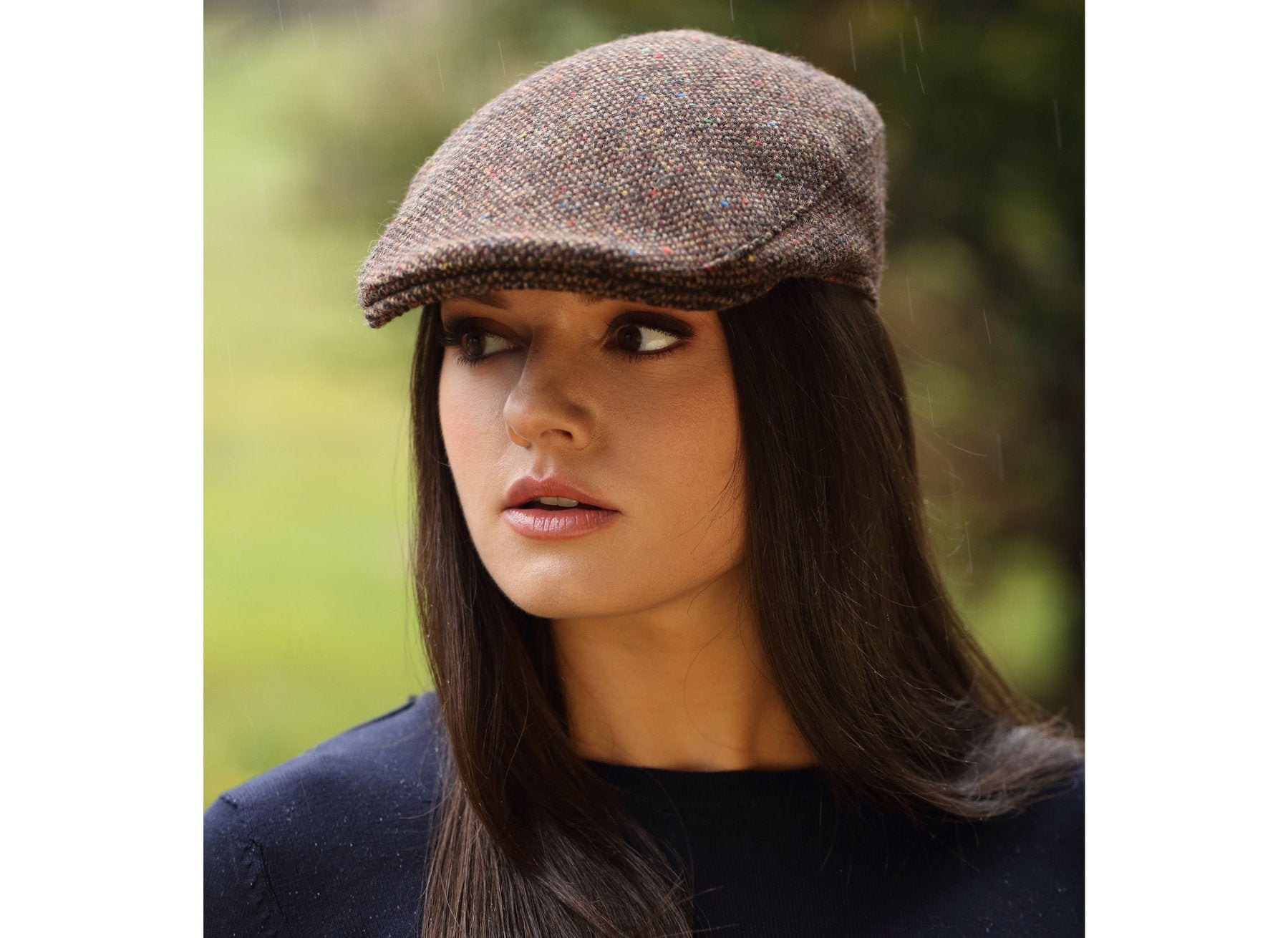 Woman wearing a Tweed Donegal Touring Cap by Hanna Hats