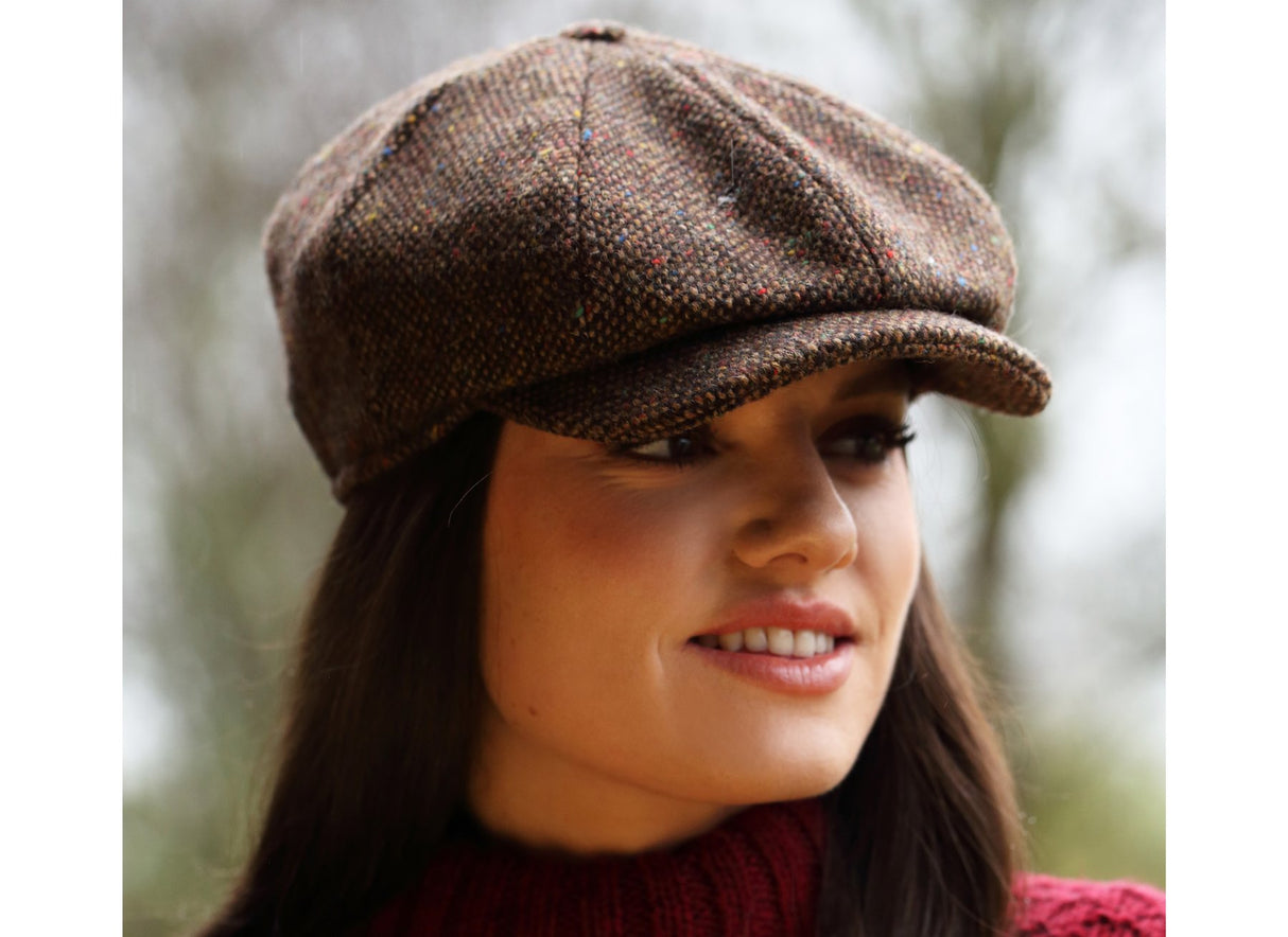 woman wearing a brown Donegal Tweed Peaky Blinders Style Cap by Hanna Hats of Donegal.
