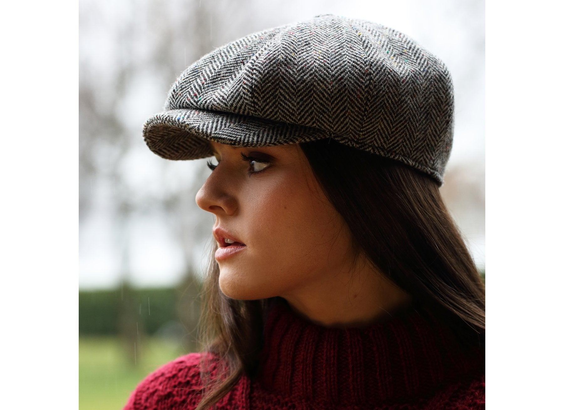 woman wearing a Wide herringbone multi fleck Peaky Blinders style cap by Hanna Hats of Donegal